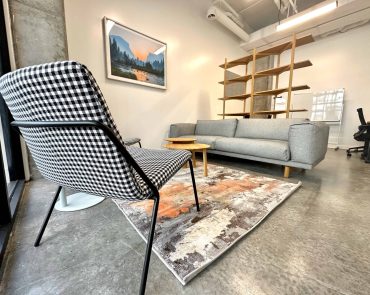 Private Office with Sectional Couch and Hanging Picture